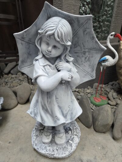 Stature- girl with umbrella.